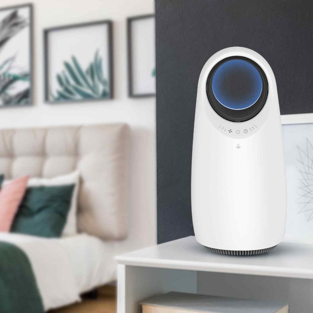 White air purifier for dust allergy with blue light on a shelf in a living room.
