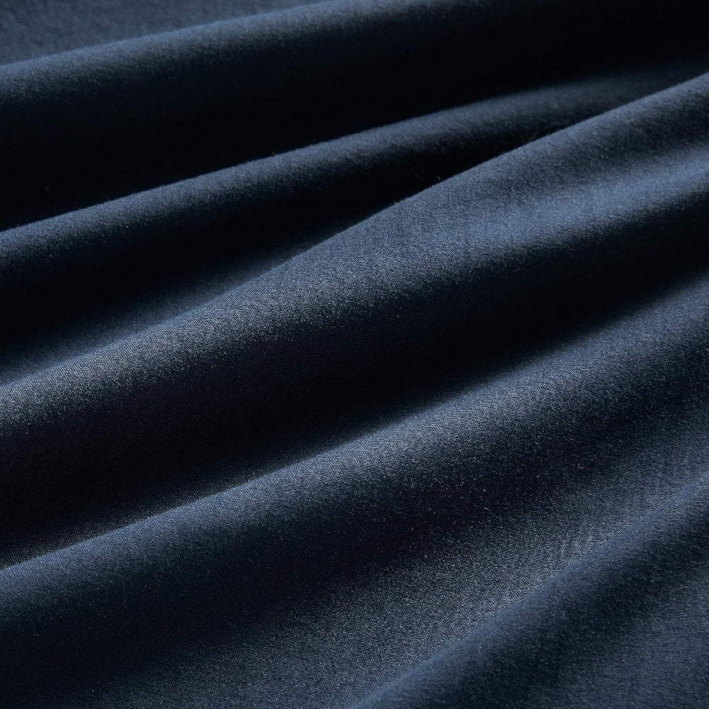 Close-up of dark blue fabric with folds