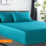 Teal bamboo bed sheet set on a bed with a plant and curtain in the background. 400TC bamboo cotton fitted sheet with pillowcases king teal soft breathable bedding Dust Mite Allergy Solutions Australia