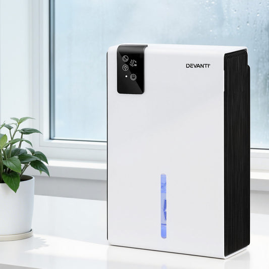Devanti air purifier on a white surface with a plant and window in the background