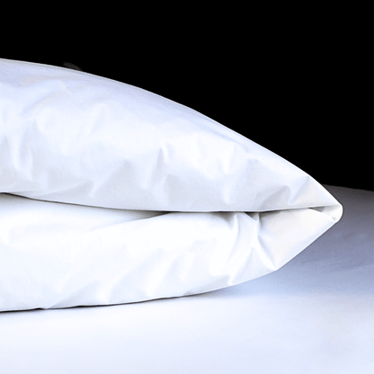 White dust mite duvet protector on a white surface with a black background