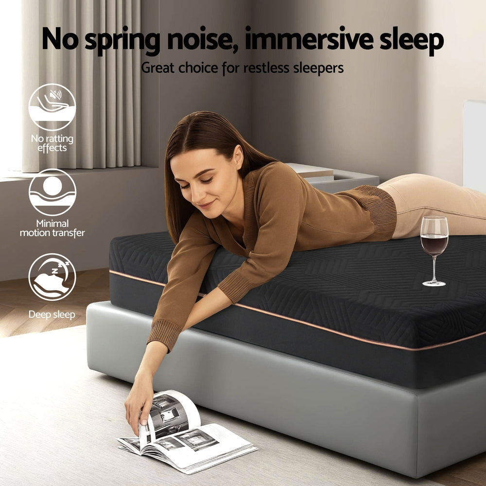 Woman lying on a mattress with a glass of wine and a magazine, promoting immersive sleep.