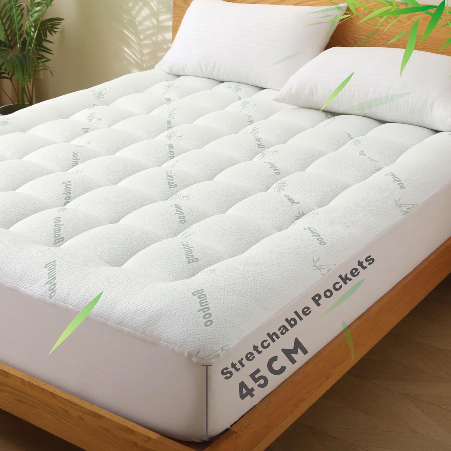 White mattress topper with 'stretchable pockets' text on a bed
