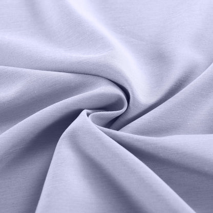 Close-up of light purple fabric with folds