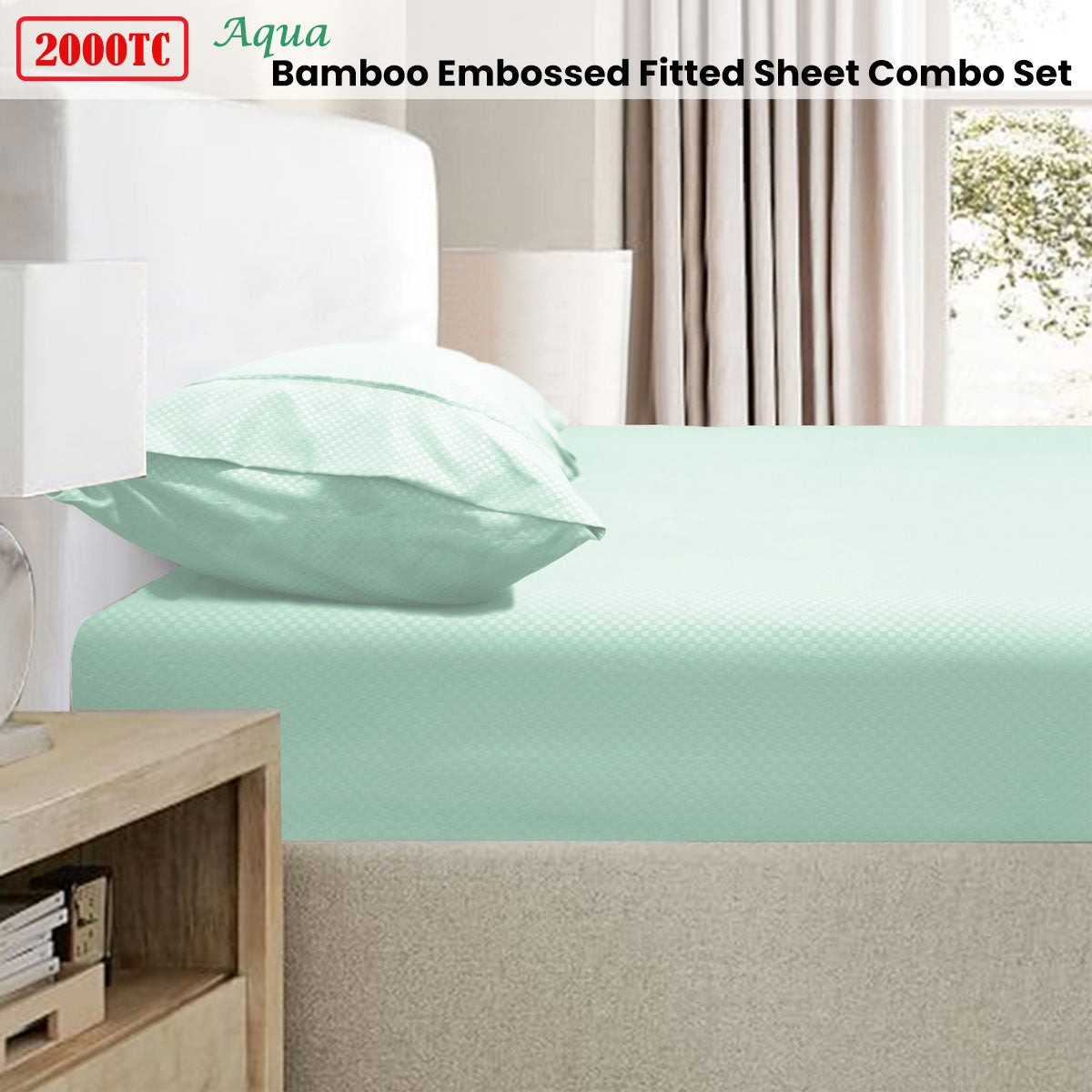 Mint green bamboo embossed fitted sheet set on a bed with pillows and a wooden nightstand.
