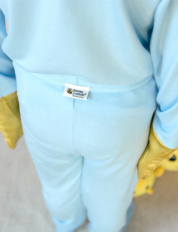 Back view of blue organic bamboo pyjama pants with a soft waistband and tag-free Honey & Stitch label