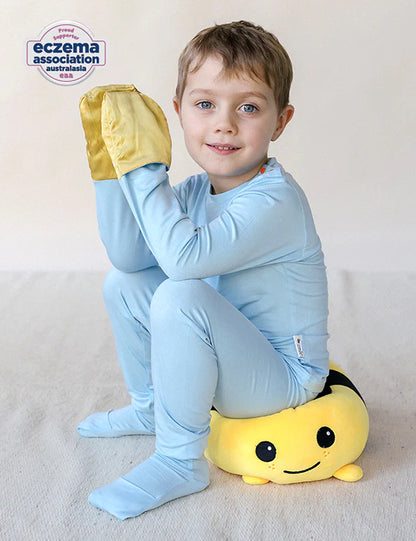 Child wearing a blue eczema-friendly organic bamboo long-sleeve pyjama set 