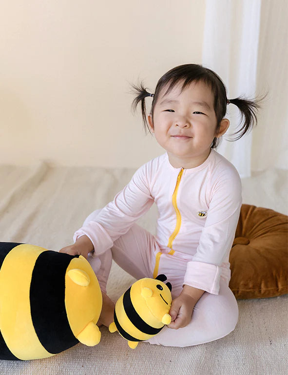 Toddler wearing a soft organic bamboo eczema-friendly onesie in pink