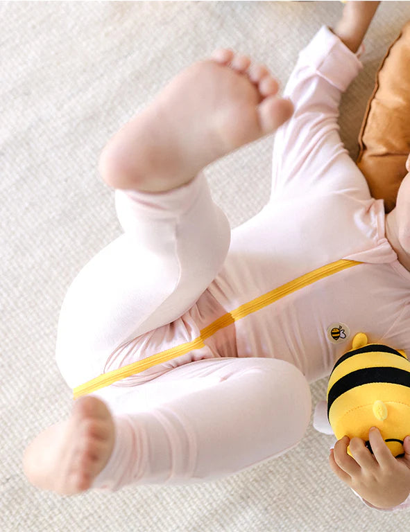 Pink organic bamboo baby onesie with silk mittens for sensitive, eczema-prone skin