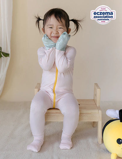 Fold-over foot cuffs on an organic bamboo baby onesie for sensitive skin