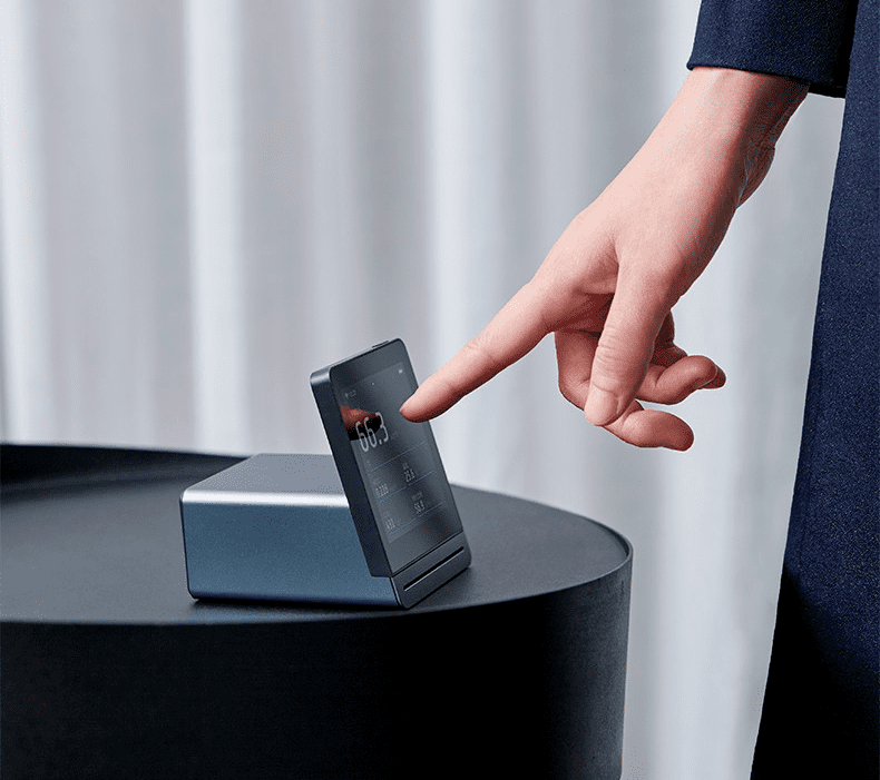 Qingping Air Monitor Gen 2 in use on desk — touchscreen interaction and Mi Home integration